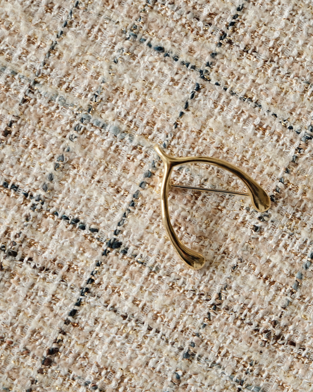 gold wish bone brooch