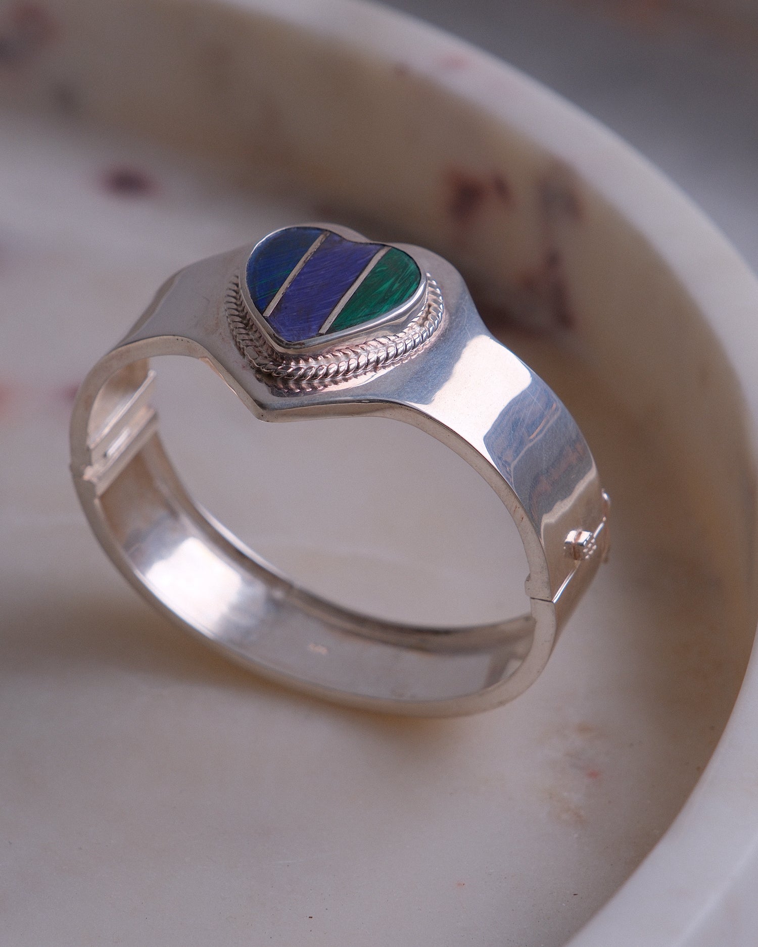 Silver cuff with a tri colour heart stone inlaid