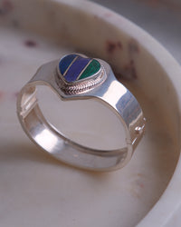 Silver cuff with a tri colour heart stone inlaid