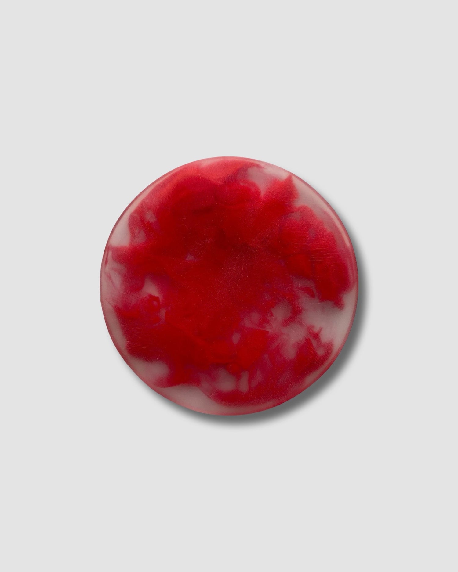 single mottled red coaster