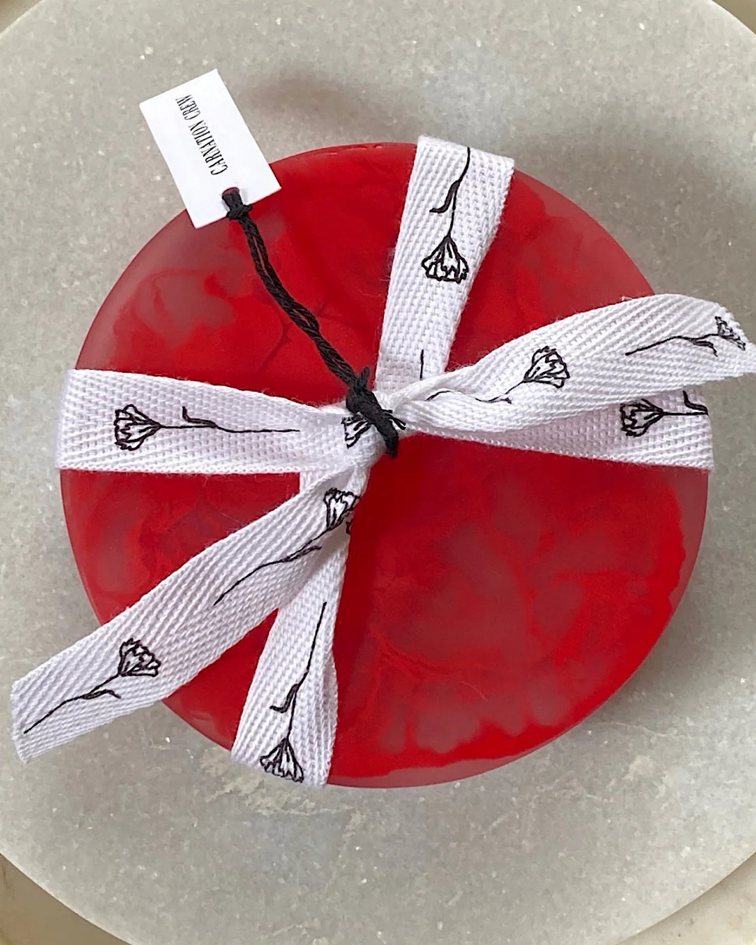 set 4 coasters red tied up with white ribbon
