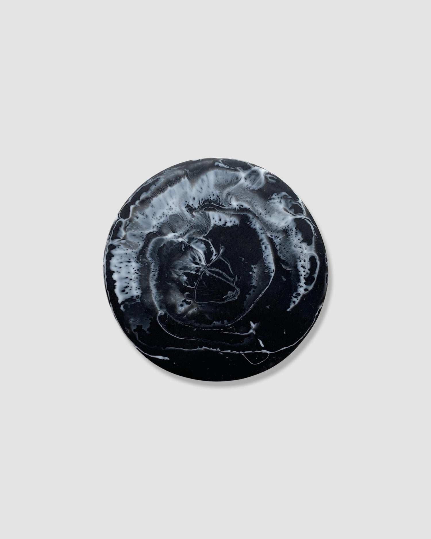 black and white mottled round coaster