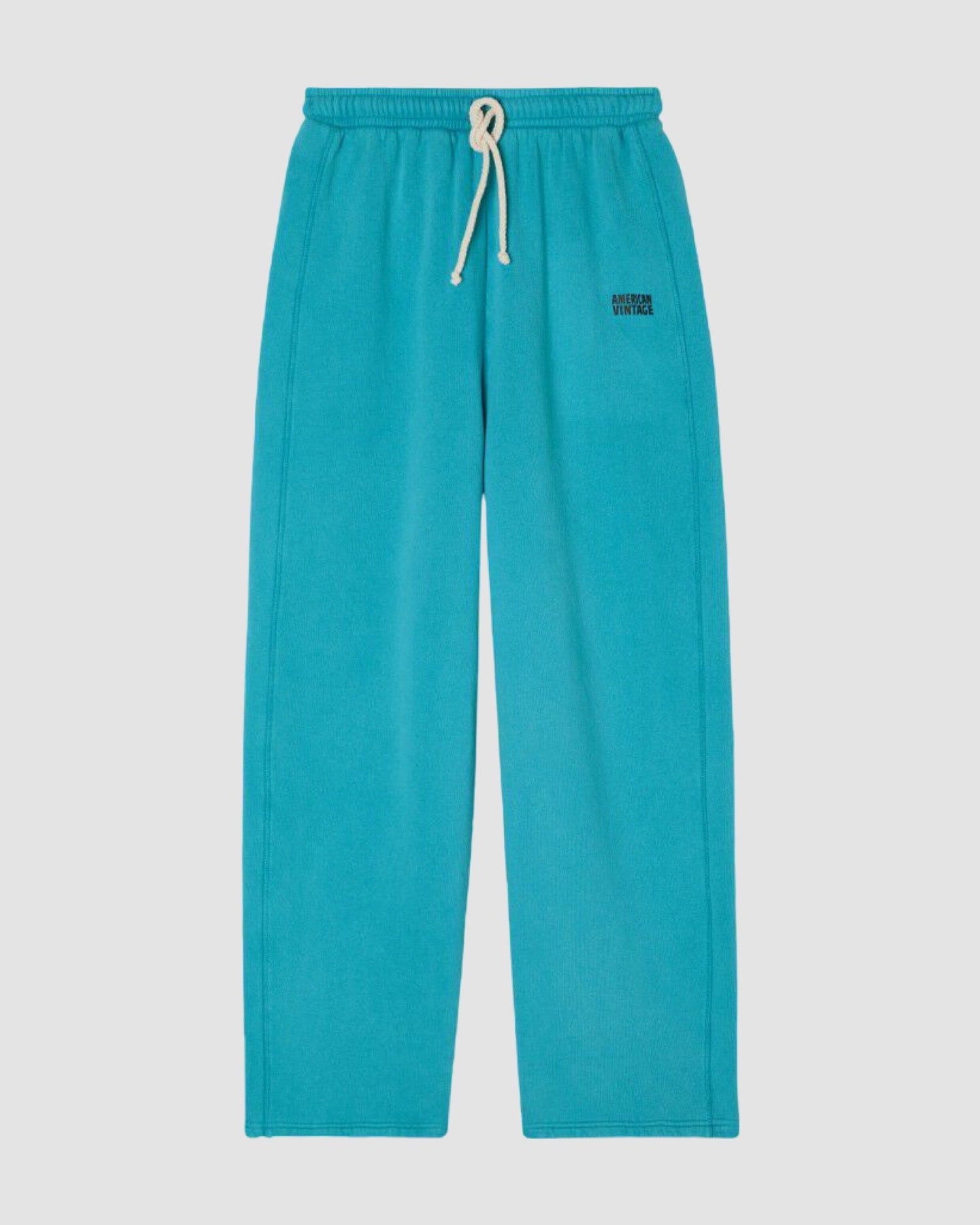 turquoise sweatpants with white drawstrings