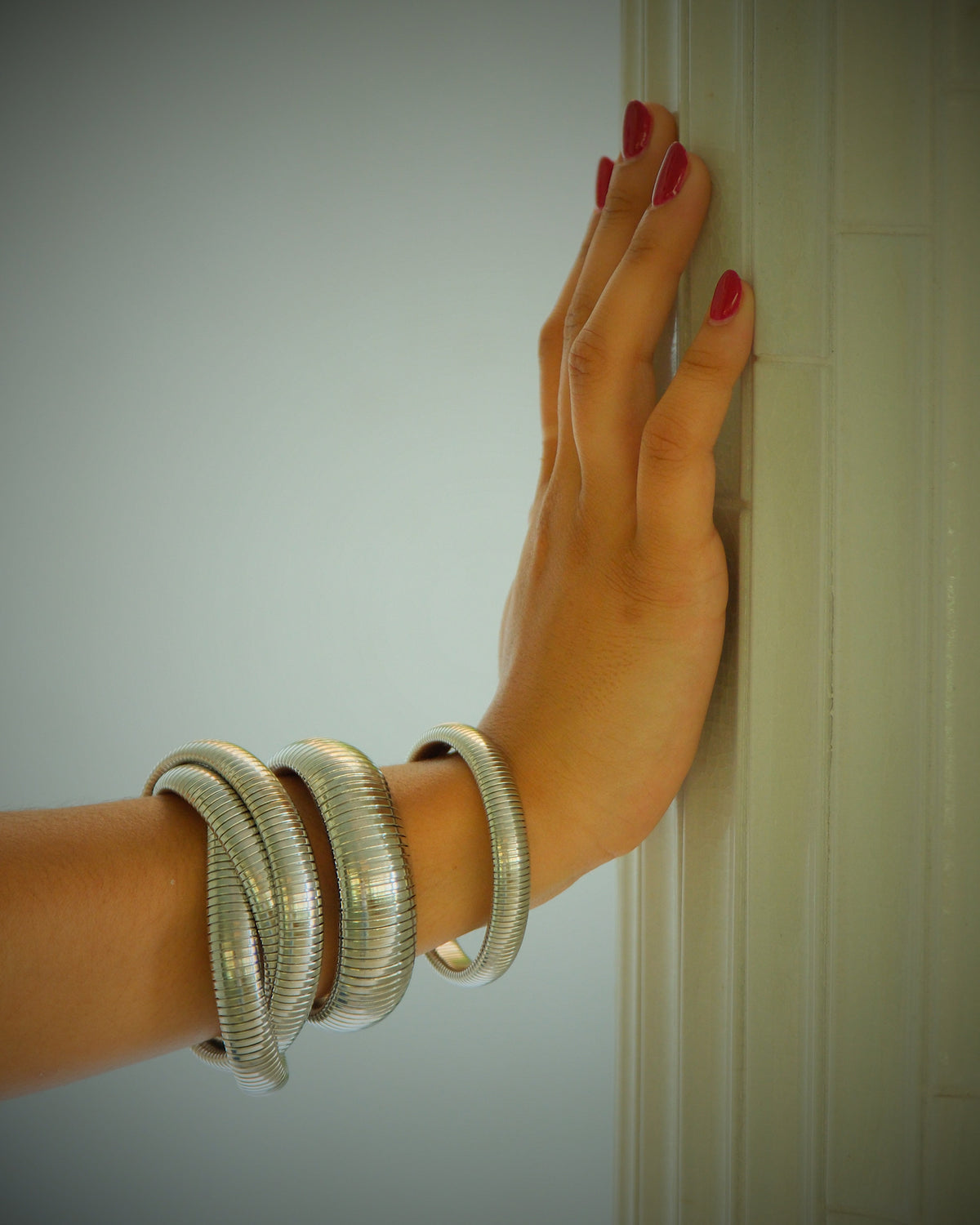 Three varying size of silver snake bangle