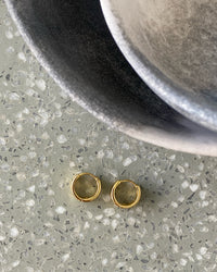 A gold pair a wave shaped small hoops