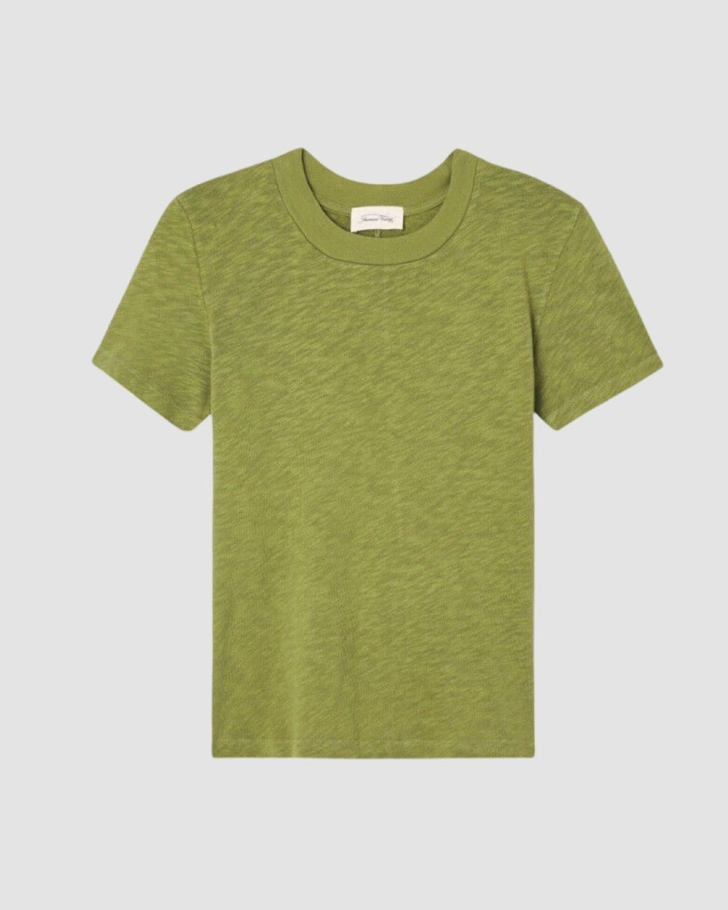 Model wears an American  Vintage Sonoma round neck T-shirt in Cameleon green