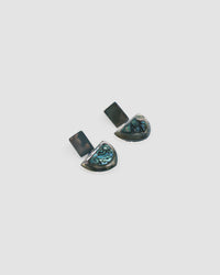 silver rectangle and abalone half circle earrings against a grey background by Carnation Crew