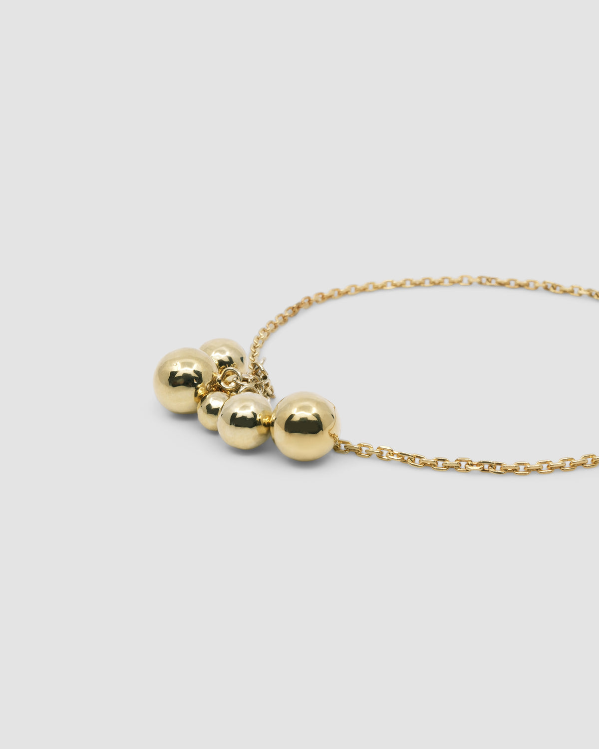 Gold chain with a cluster of gold balls forming an Anklet from the Pared Store