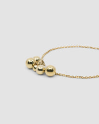 Gold chain with a cluster of gold balls forming an Anklet from the Pared Store