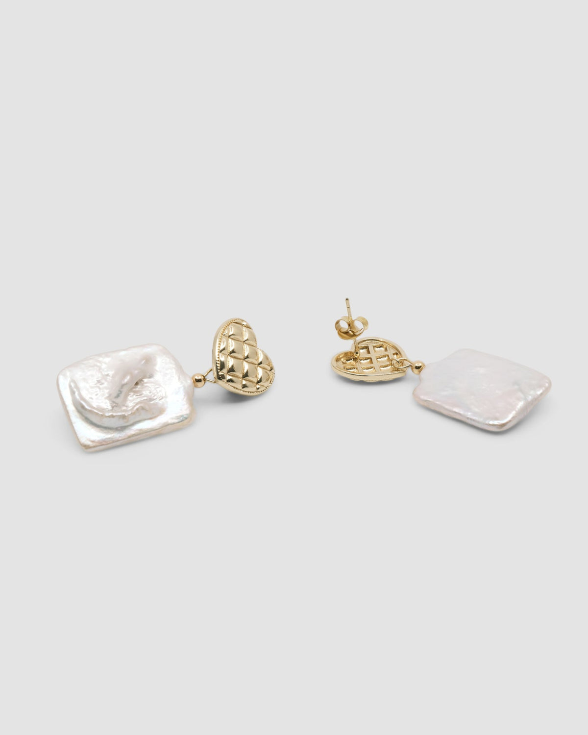 gold quilted studs with rectangular pearls hanging from them