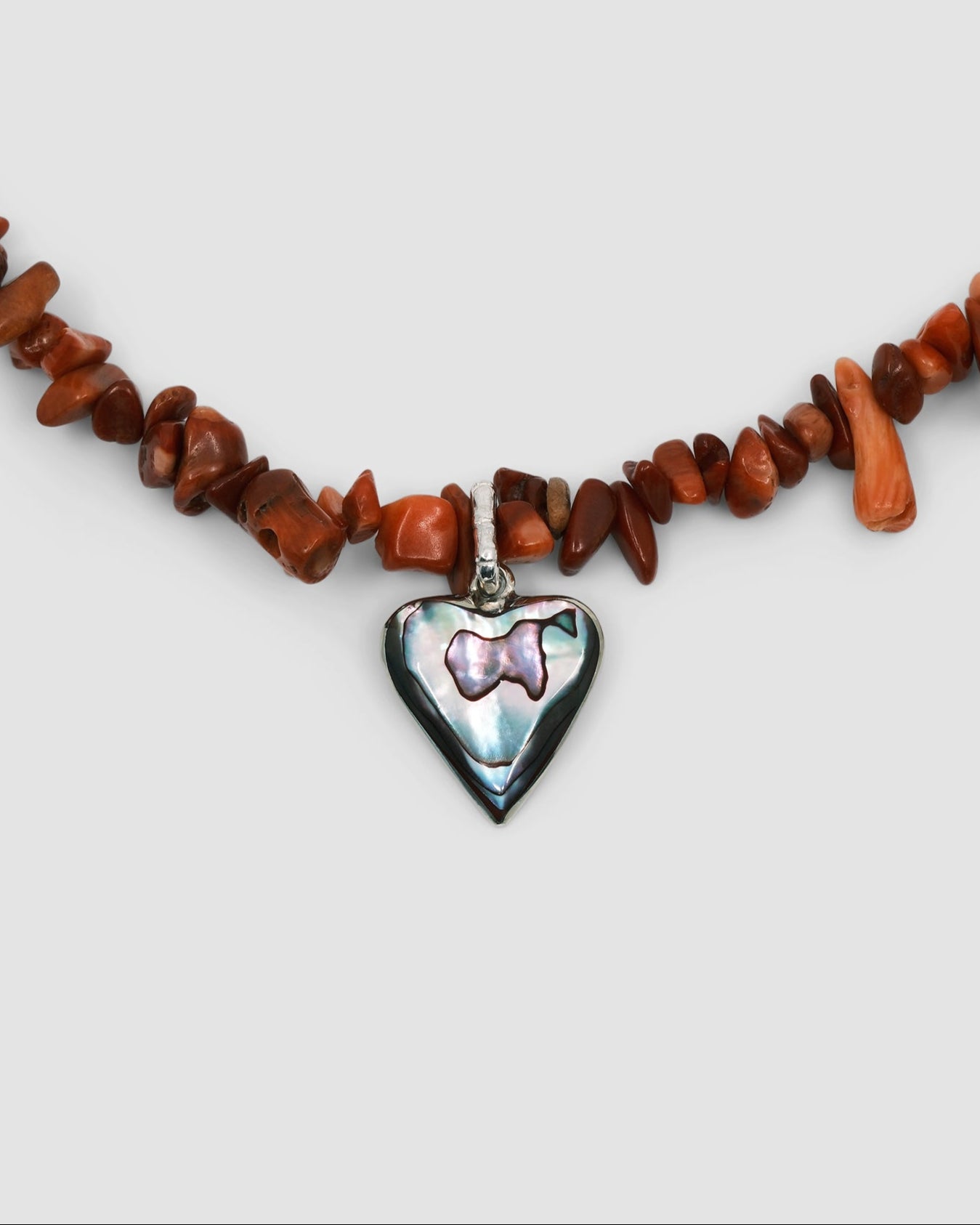 a red coral jagged necklace with a central abalone heart charm