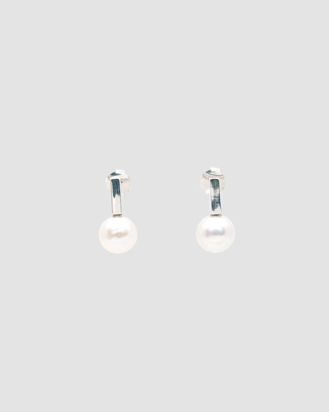 thin short silver bar earrings with pearls attached s