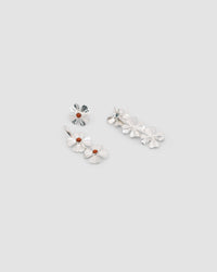 two triple silver clover earringslie on a greay background displaying the abilty for them to come apart