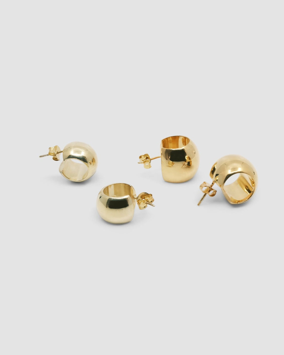 Extra thick and thick small wide gold hoop earrings side by side
