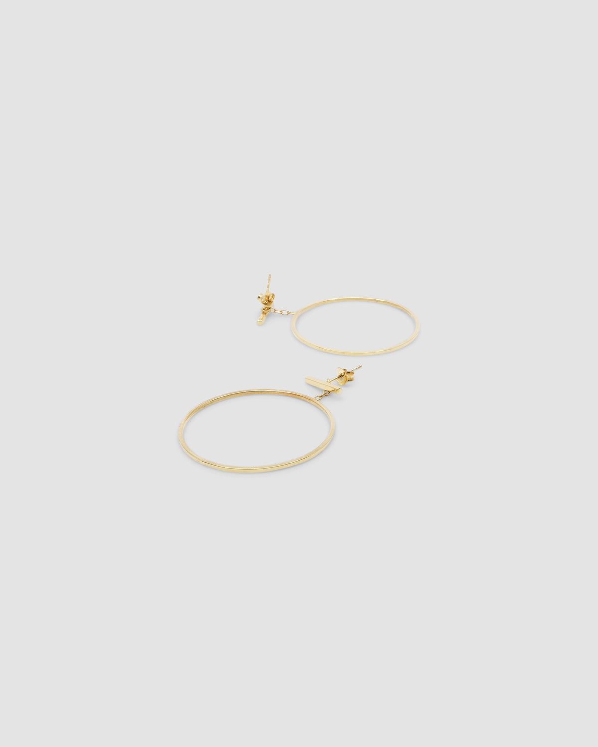 gold circles dangling off a bar
