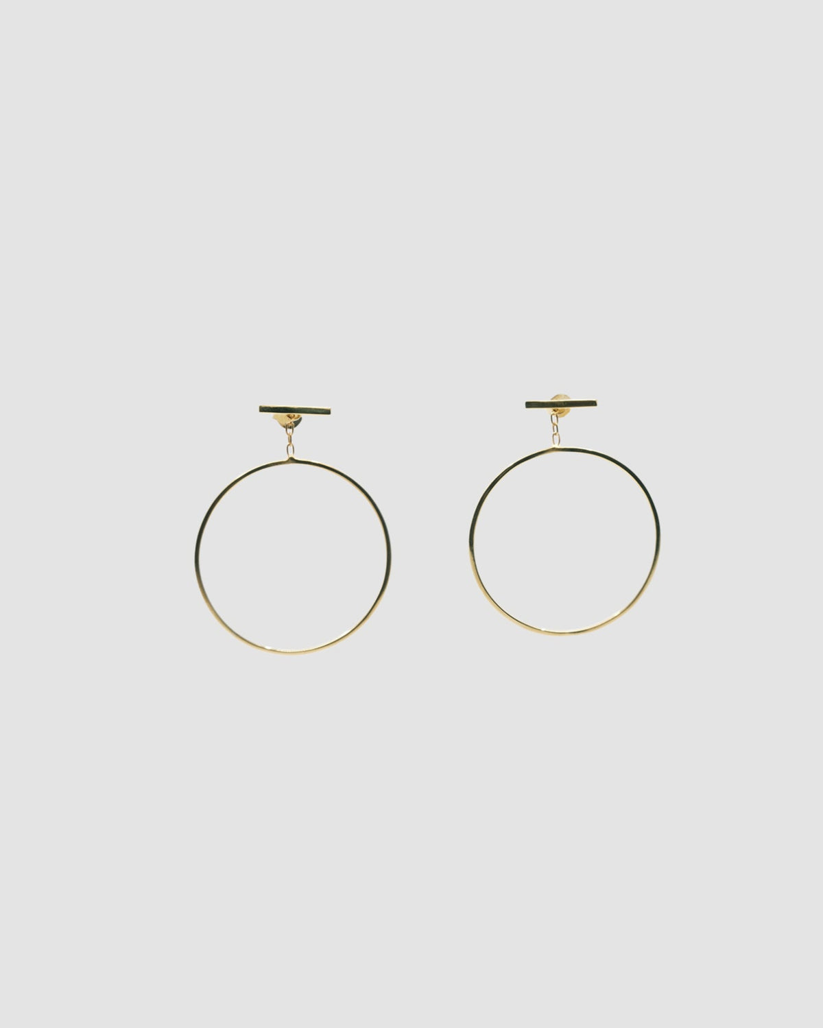 gold circles dangling off a bar