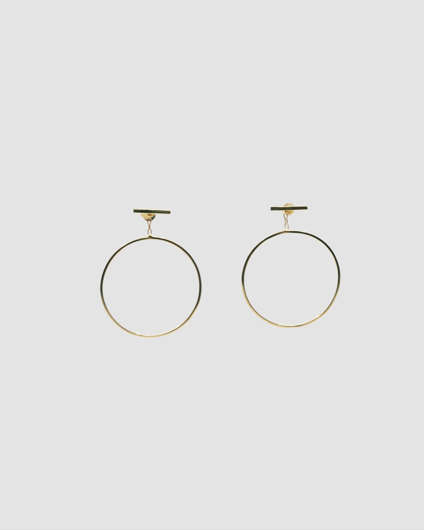 gold circles dangling off a bar