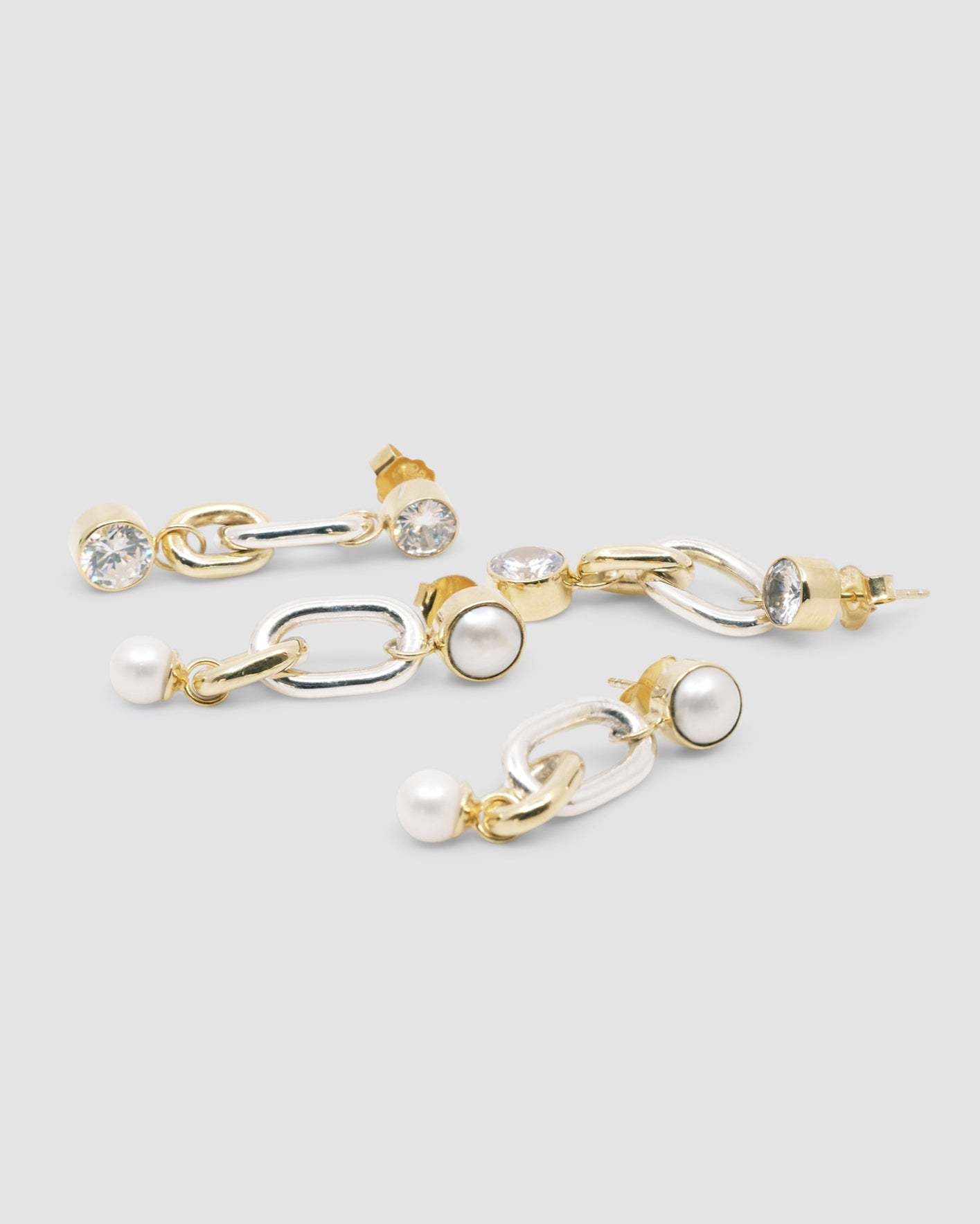 two pairs mixed metal drop earrings - one wth pearl, one with crystal