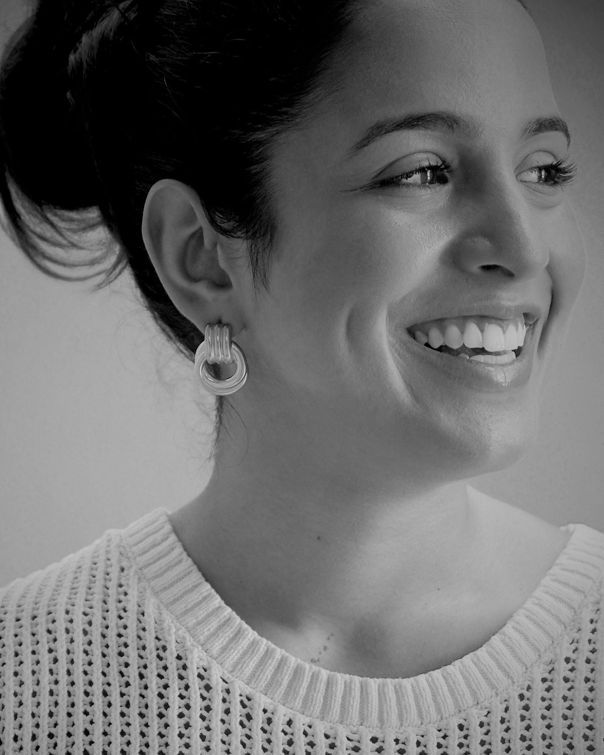 model wears mixed metal elvra earrings