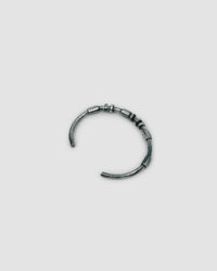 dark blackened silver thin cuff bangle with oval tube silver bead detail
