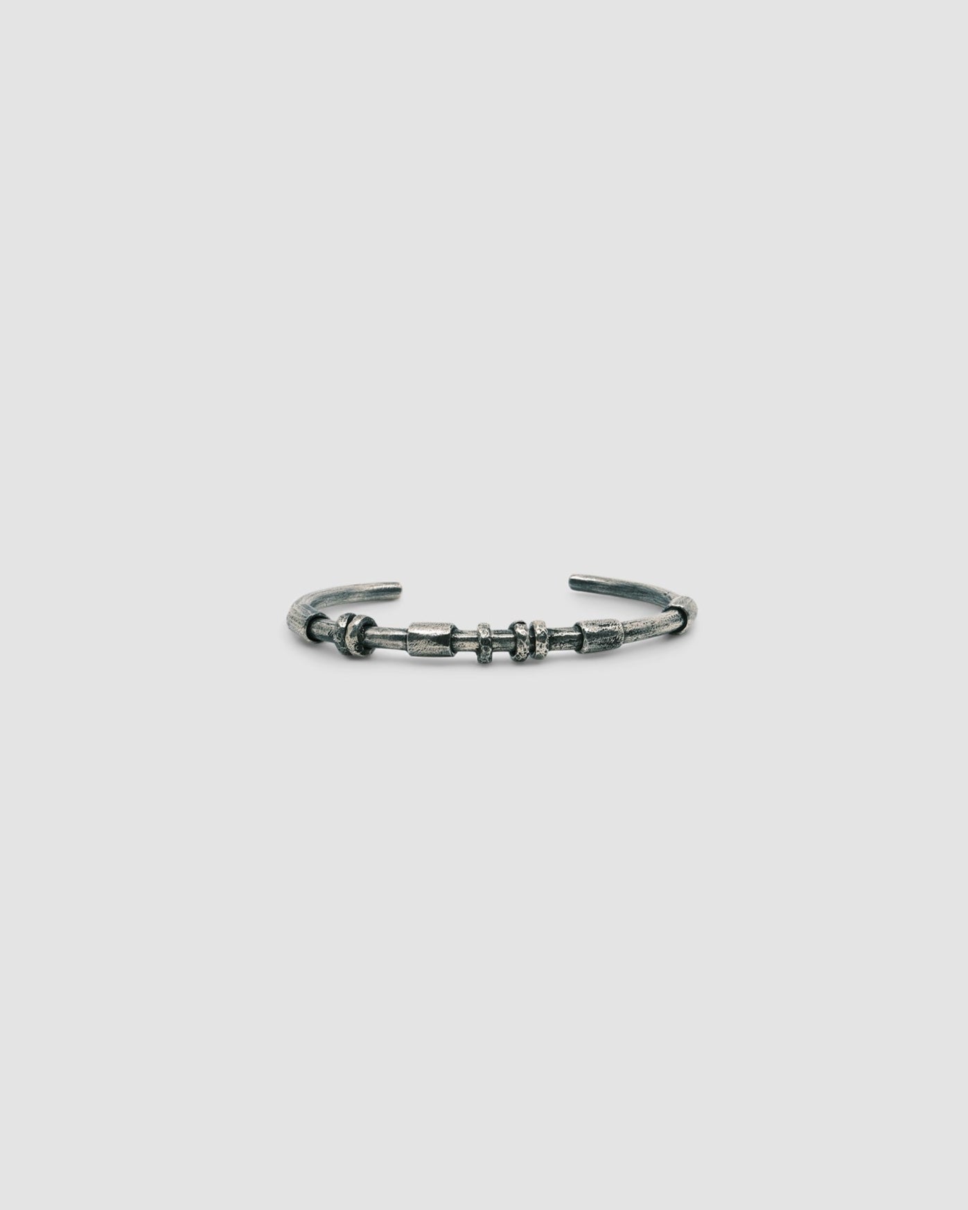 dark blackened silver thin cuff bangle with oval tube silver bead detail