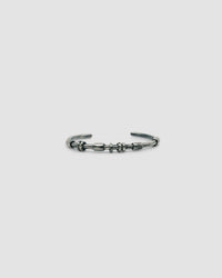 dark blackened silver thin cuff bangle with oval tube silver bead detail