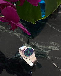 sterling silver cuff with a amazonite stone inlaid in it