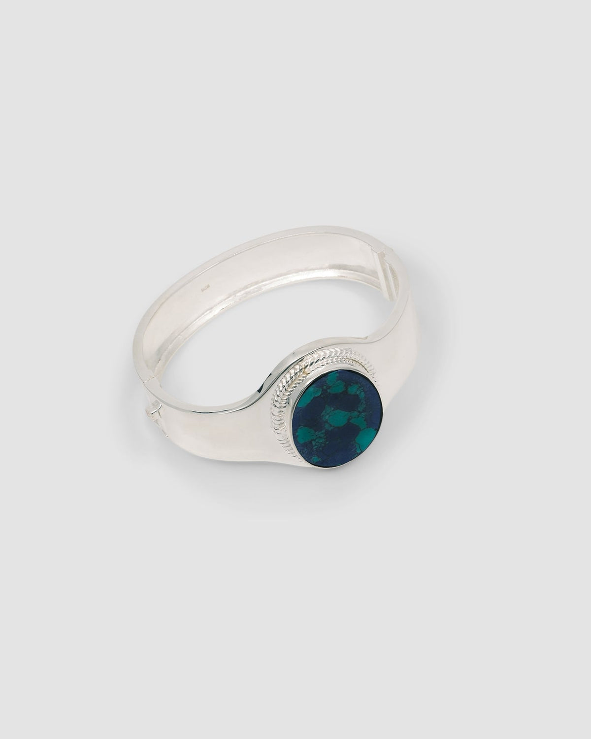 sterling silver cuff with a amazonite stone inlaid in it