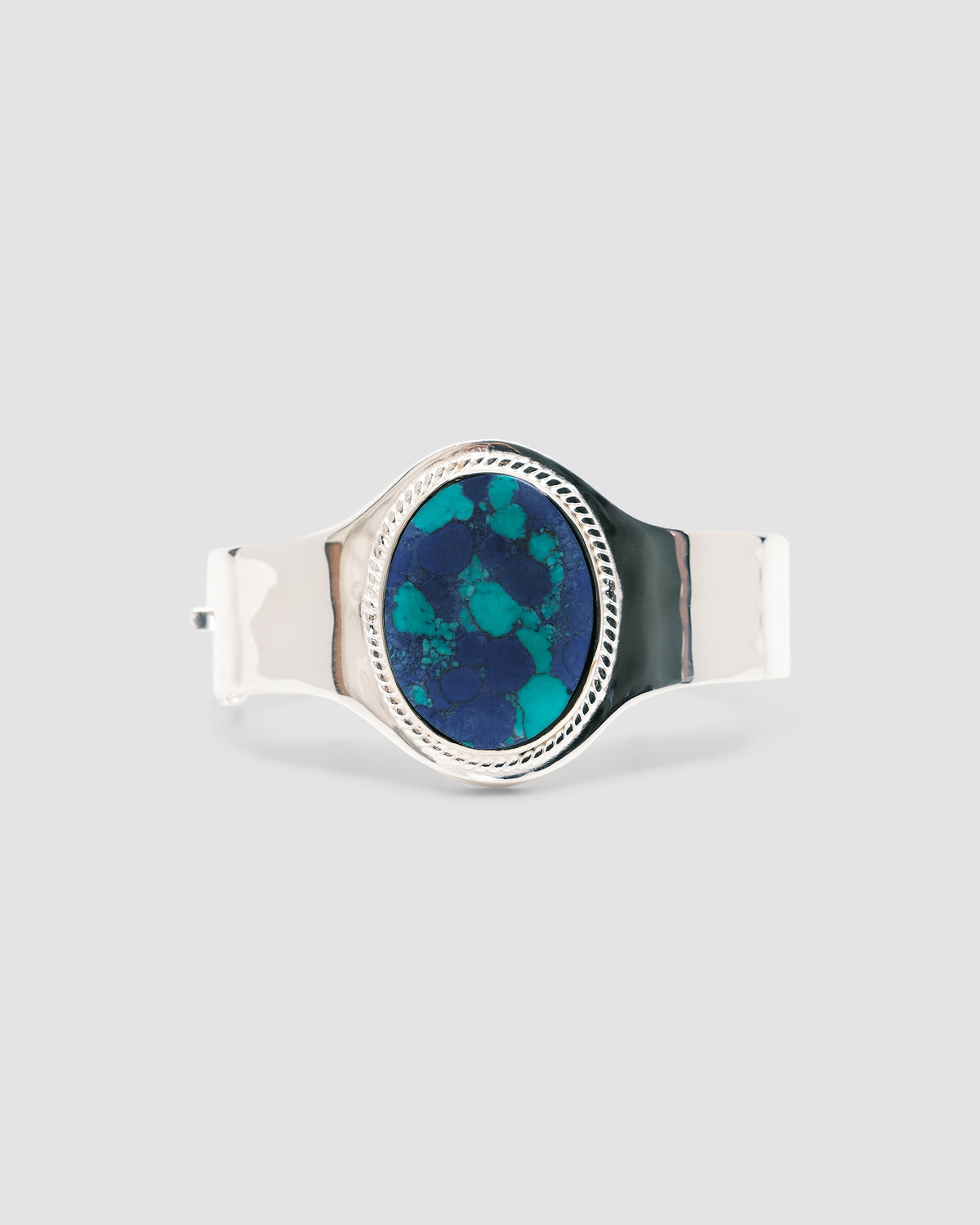 sterling silver cuff with a amazonite stone inlaid in it