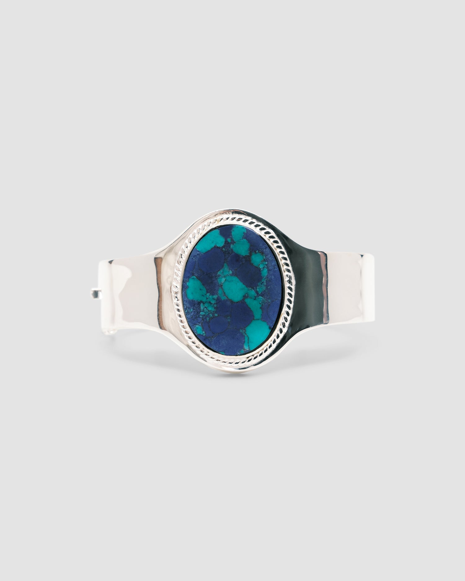 sterling silver cuff with a amazonite stone inlaid in it