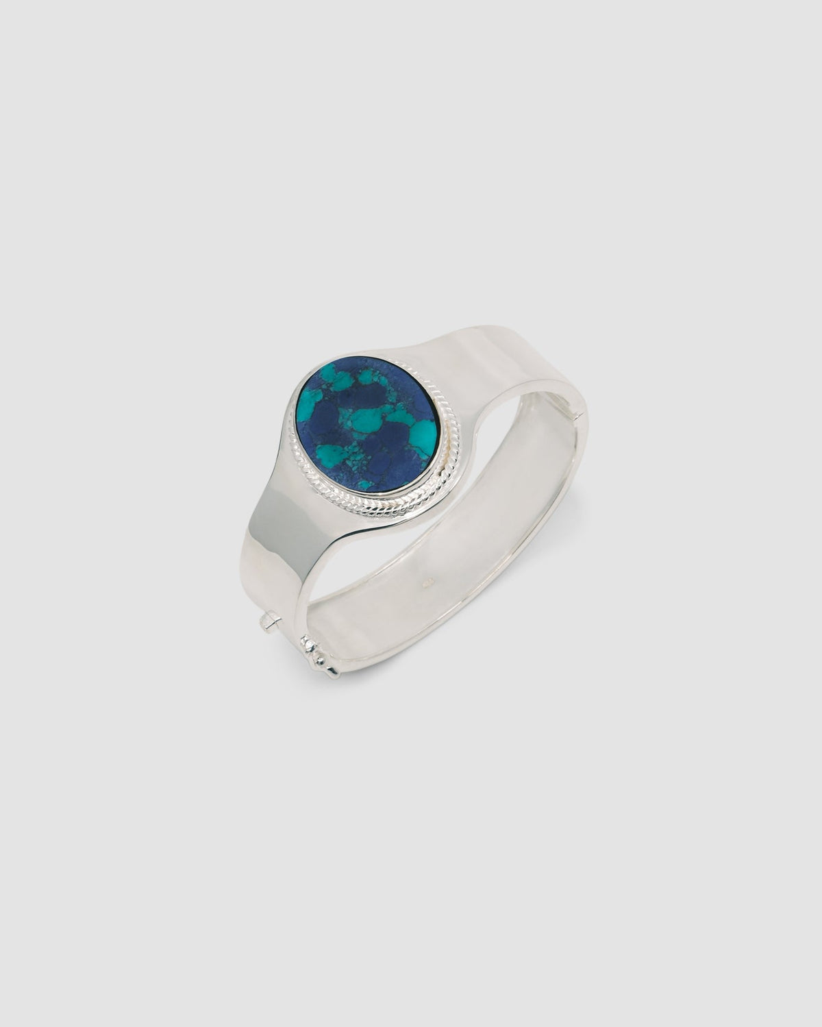 sterling silver cuff with a amazonite stone inlaid in it