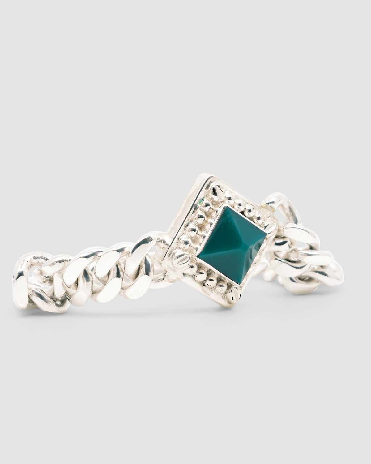 silver cuban chain link necklace with a square pendant set with a green pyramid stone