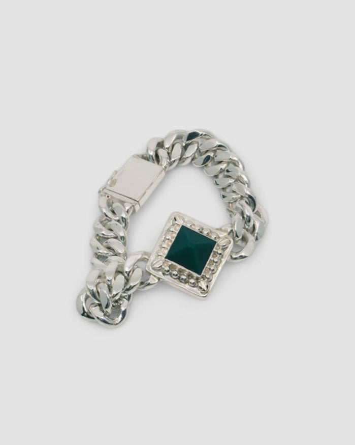 silver cuban chain link necklace with a square pendant set with a green pyramid stone
