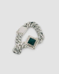 silver cuban chain link necklace with a square pendant set with a green pyramid stone