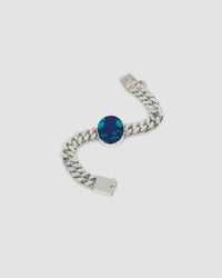 a silver link chain bracalet with a large blue green stone set in the middle