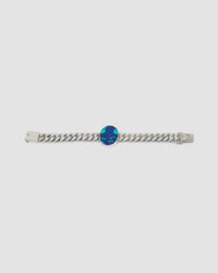 a silver link chain bracalet with a large blue green stone set in the middle