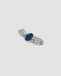 a silver link chain bracalet with a large blue green stone set in the middle