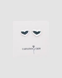silver heart earrings on a branded card
