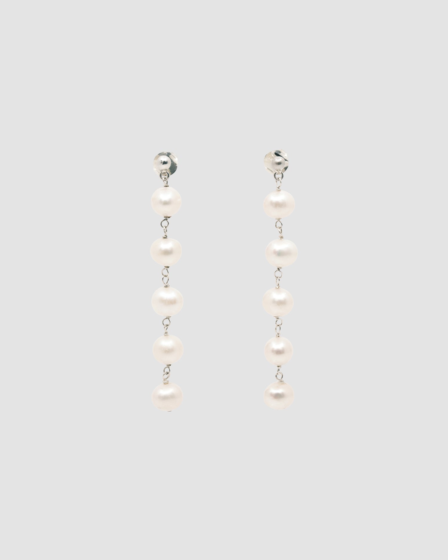 multiple pearl and silver stud earrings