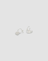 Matt silver lips are suspended from matt silver hoop earrings