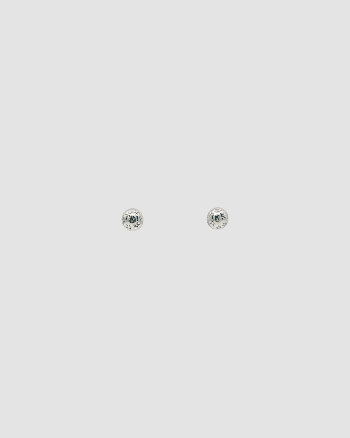 tiny star stamped silver stud earrings