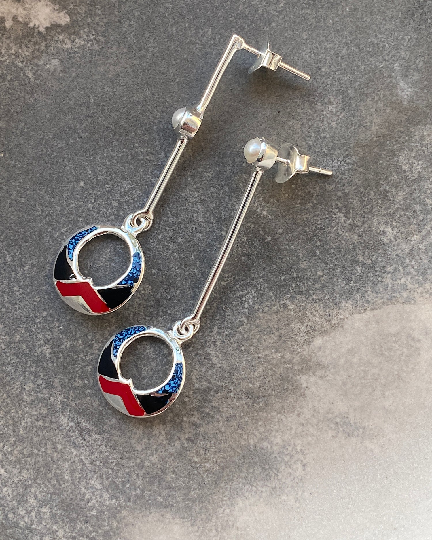 silver drop earrings with red, black & blue and shell drop charms and odd pearls on the drop