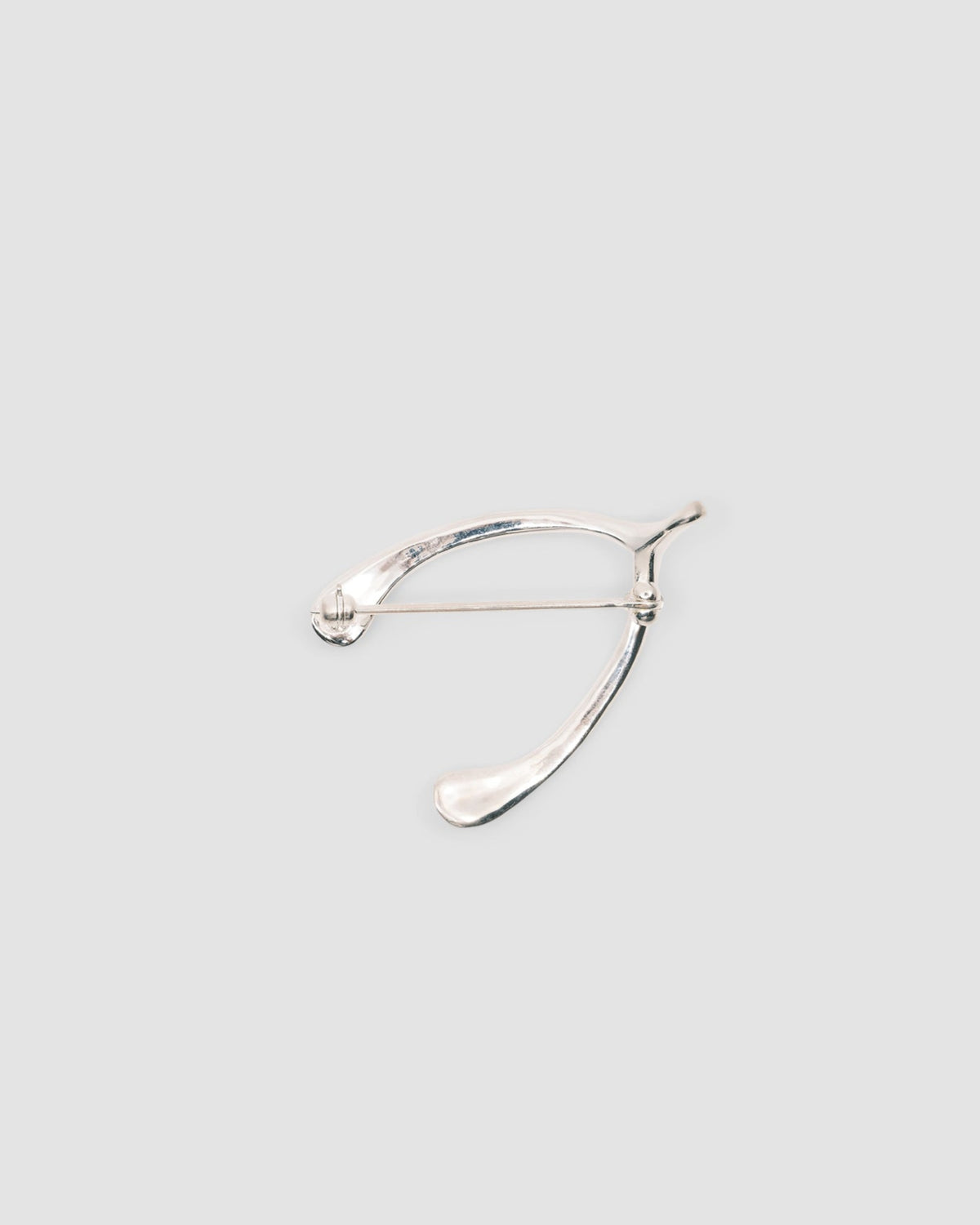 back view of a sterling silver woshbone brooch from the pared store