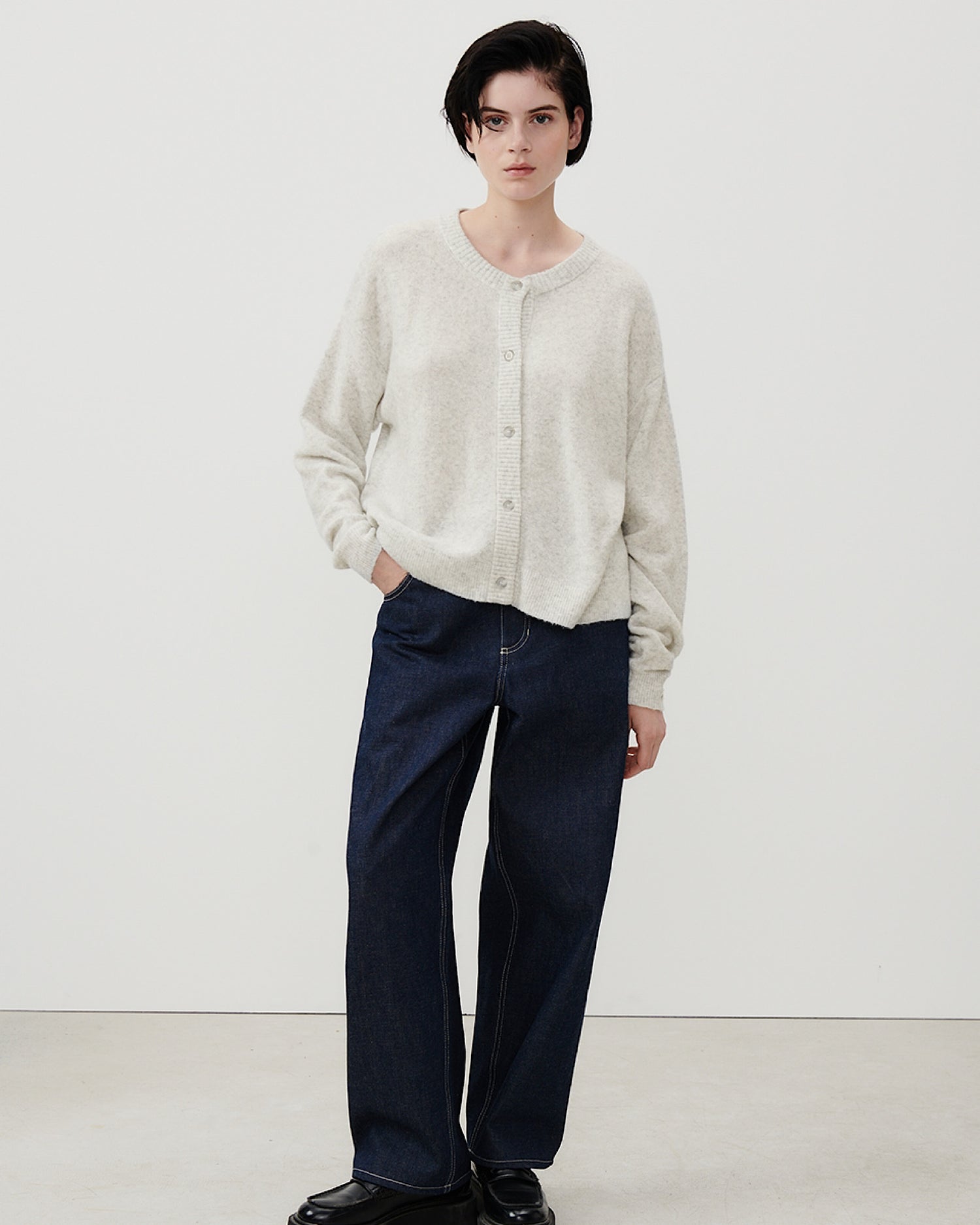 Grey round neck American Vintage Damsville Cardigan worn by a model available at The Pared Store