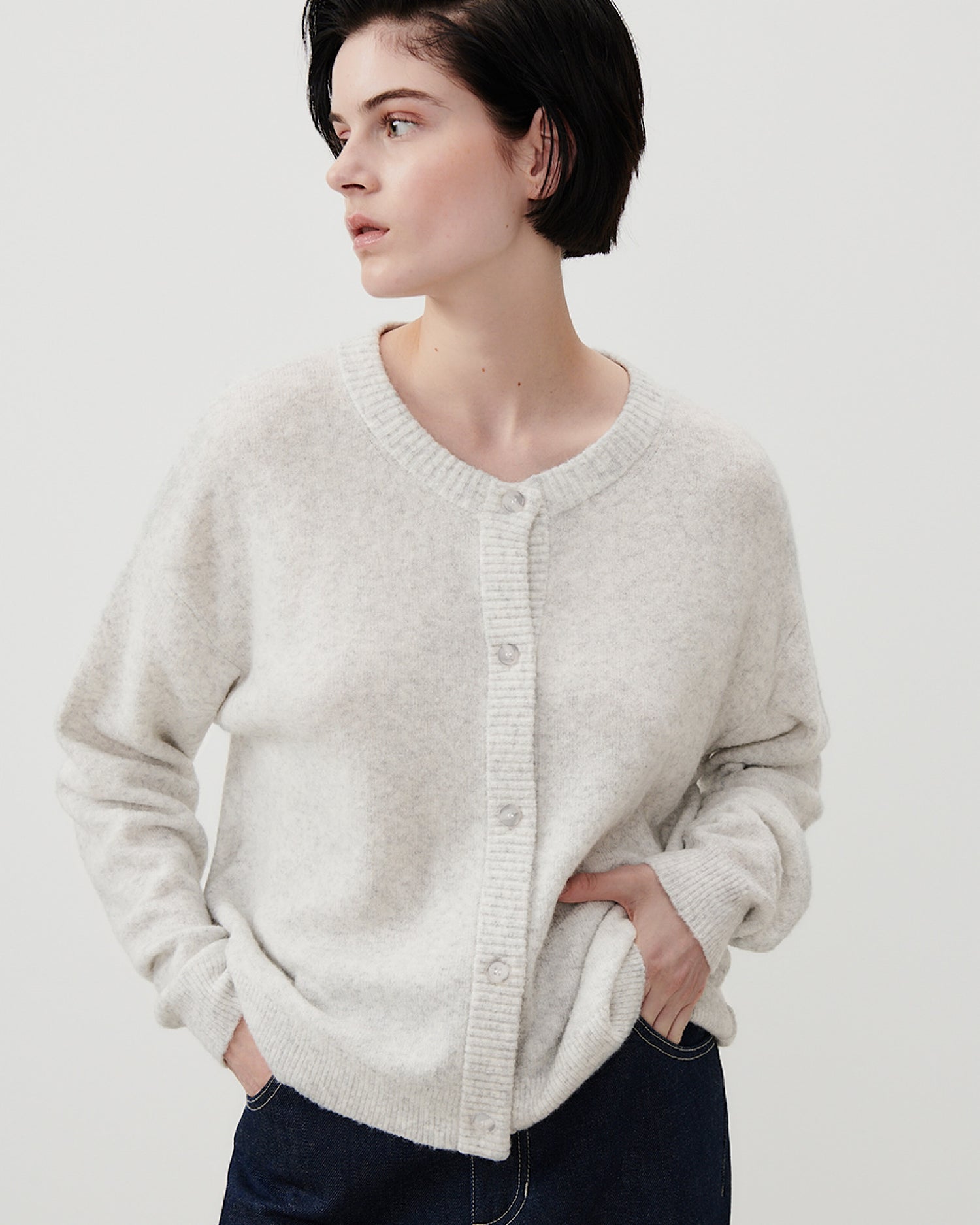 Grey round neck American Vintage Damsville Cardigan worn by a model available at The Pared Store