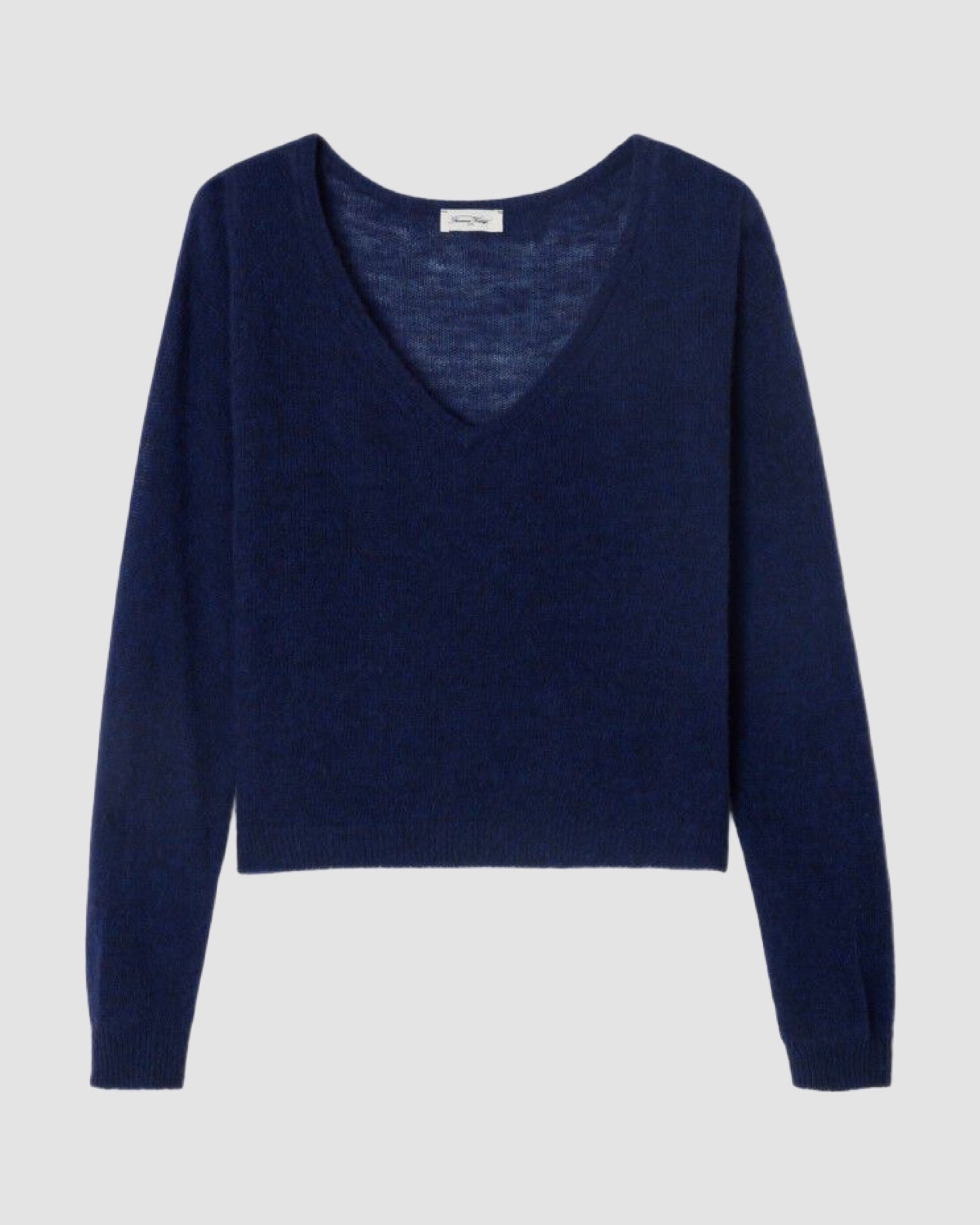 Navy blue sweater on a light gray background