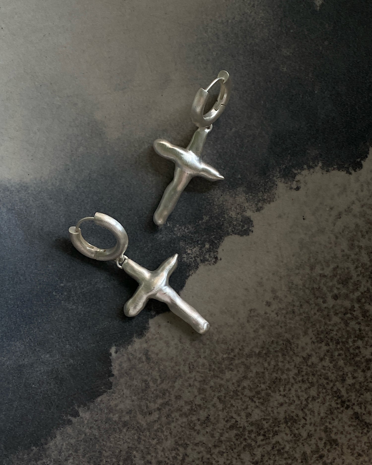 Uneven cross shaped sterling silver matt earrings by Fairley