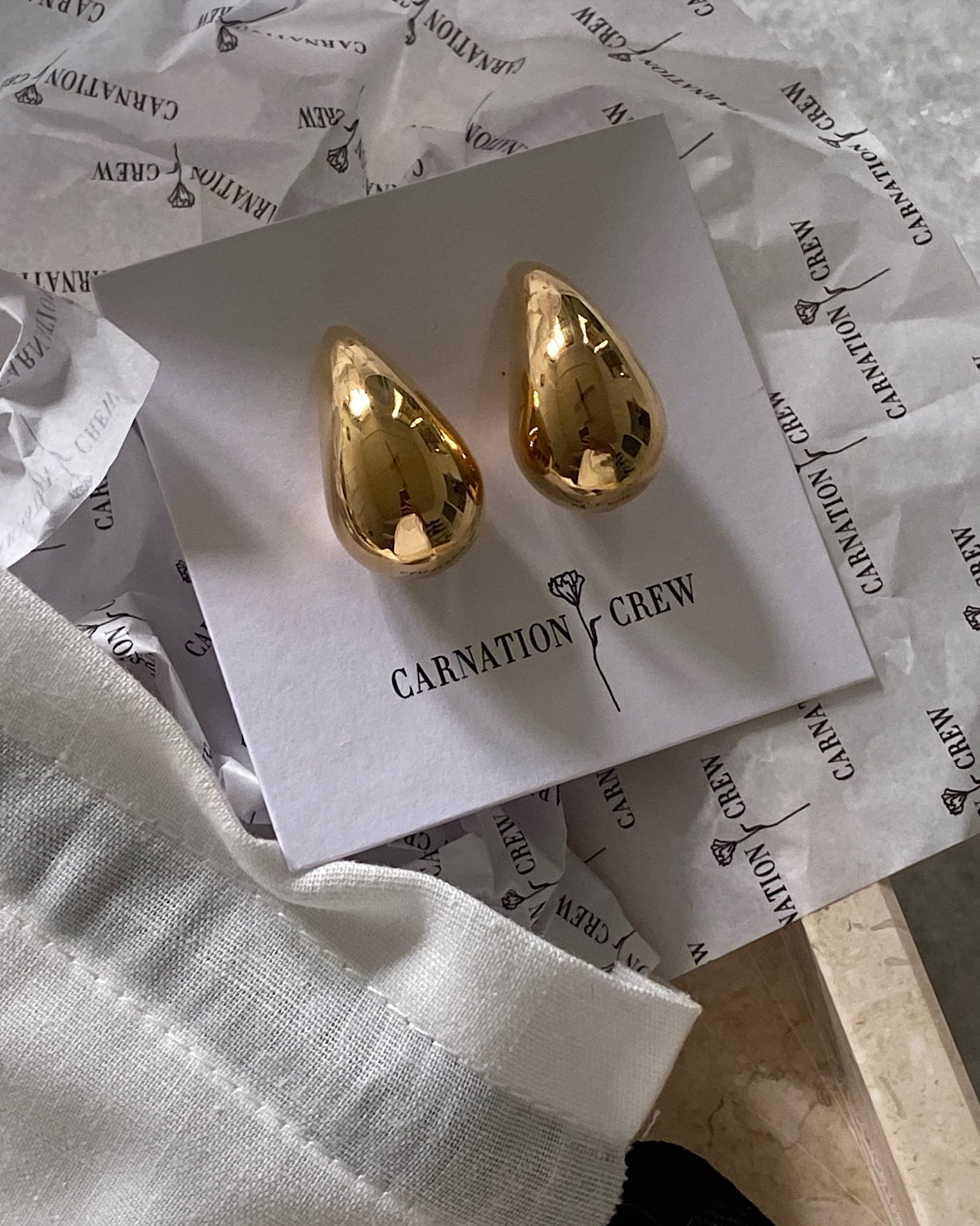 Gold sloane earrings wrapped