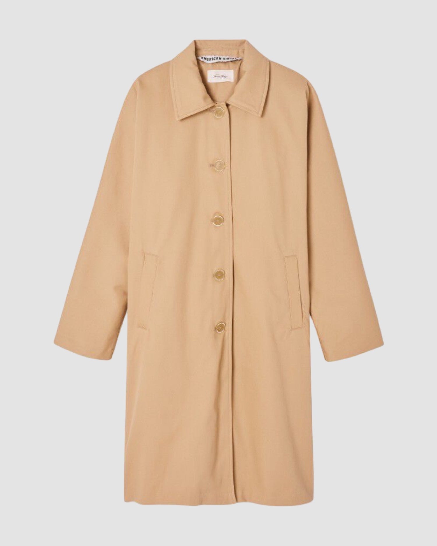 Beige coat on a light gray background