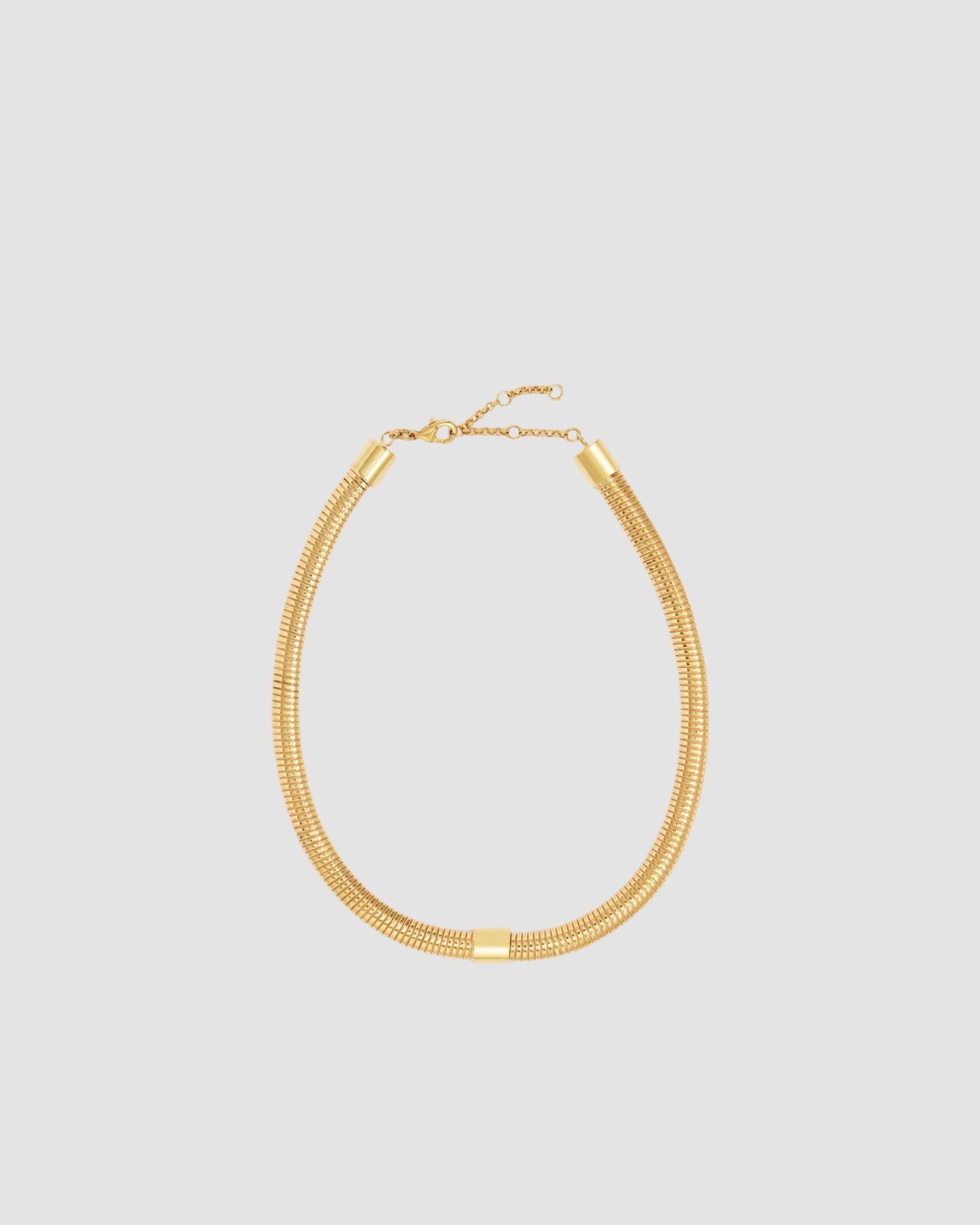 a wide gold snake chain necklace with an extender chain